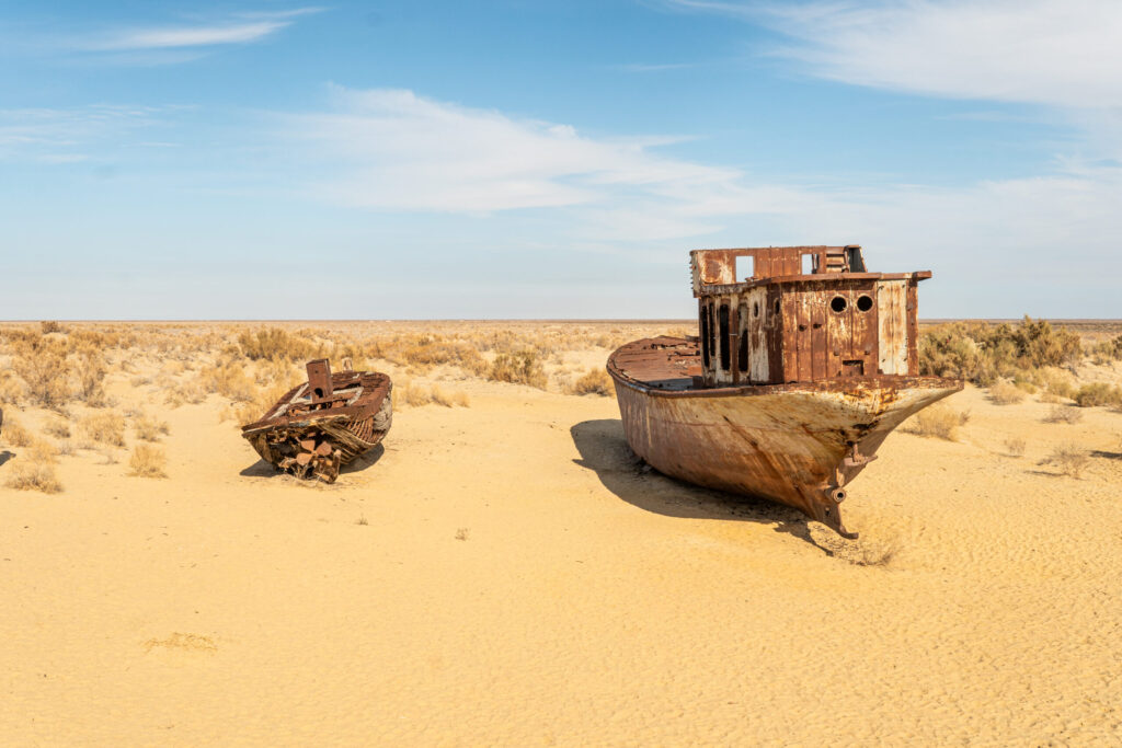 Rusty abandoned ships at the Ship cemetery at the former Aral sea coast in Moynaq (Mo ynoq or Muynak), Uzbekistan