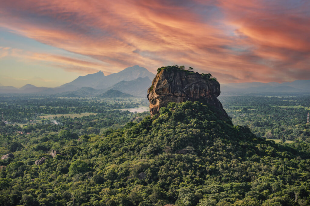Spectacular view of the Lion rock surrounded by green rich vegetation. Picture taken from Pidurangala Rock in Sigiriya, Sri Lanka.