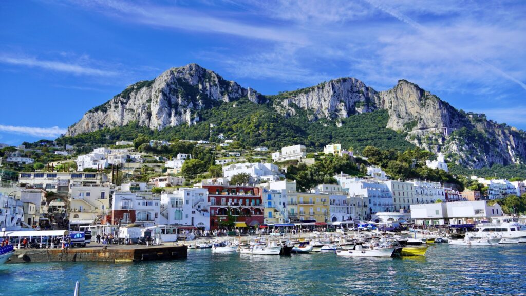 Capri Italy Oct 12, 2025 View of the ferry docks and the town of Marina Grande on the picturesque island of Capri in the Tyrrhenian Sea, Italy